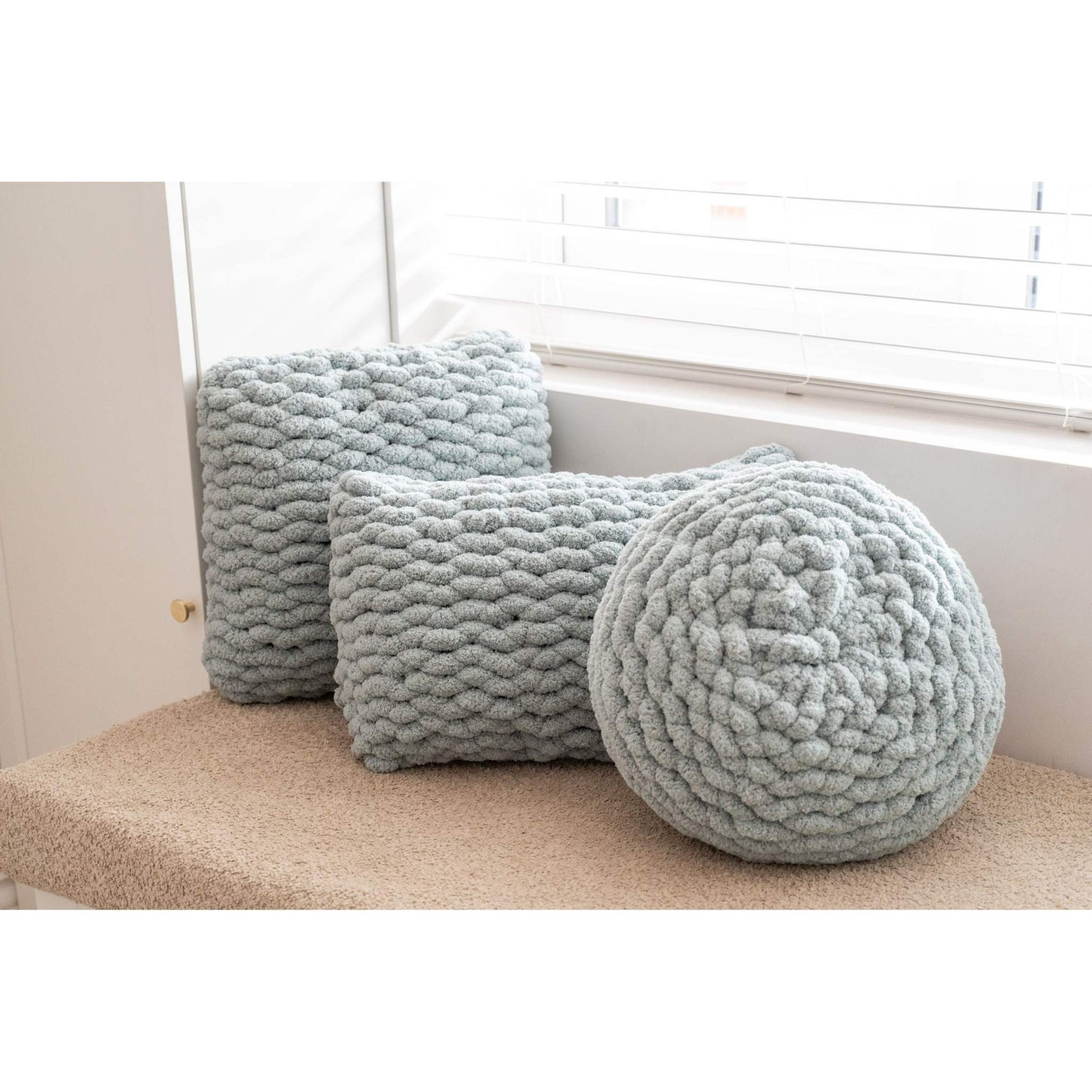 trio of mist green hand knit cushions