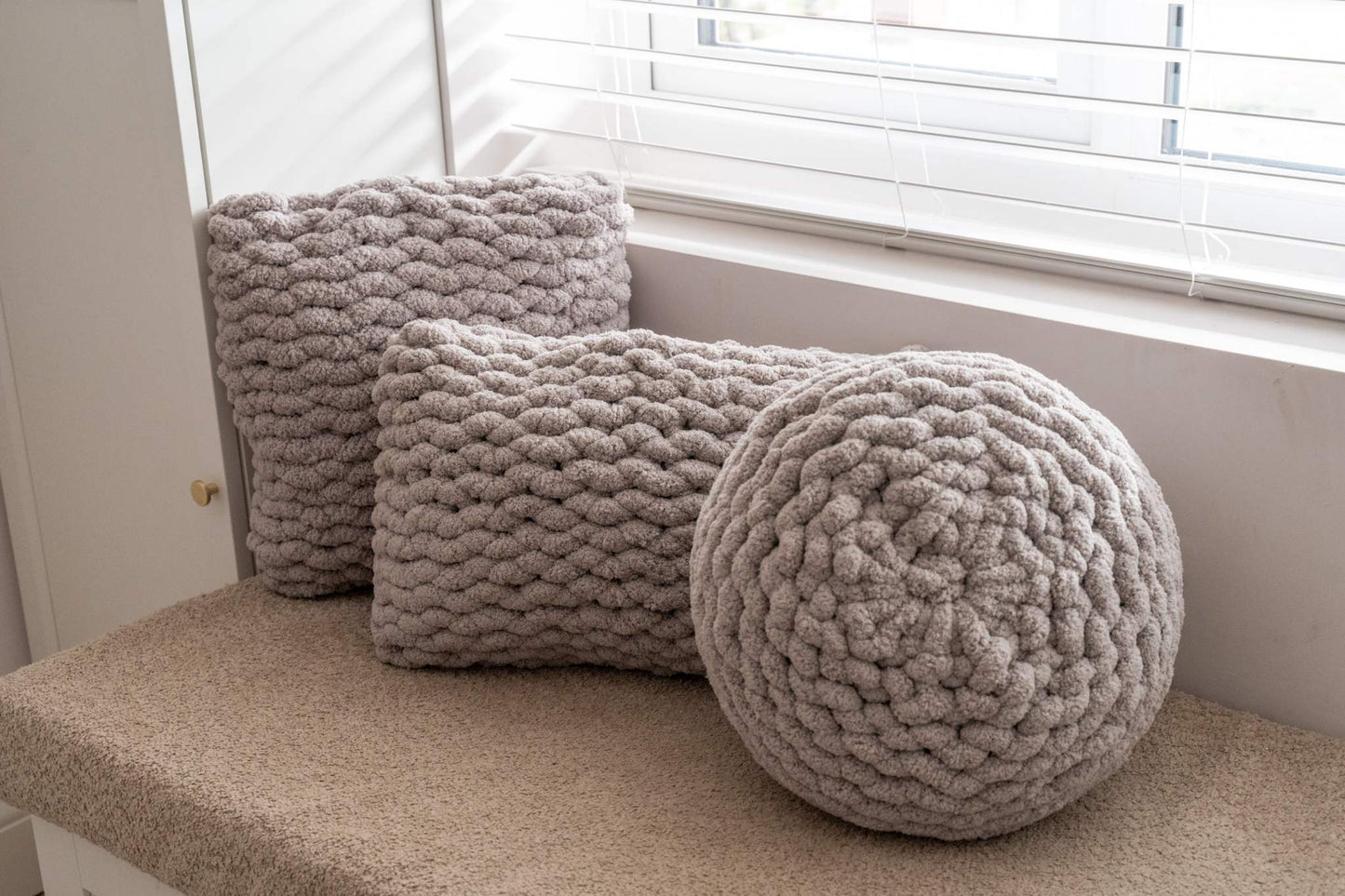 trio of taupe grey cushions