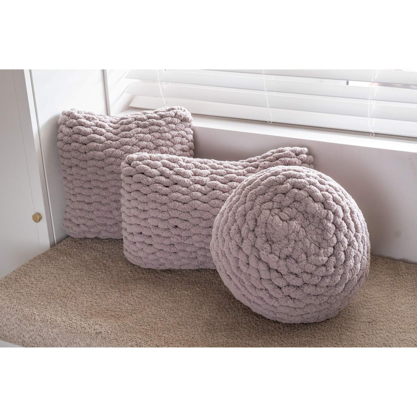 trio of hand knit cushions in grey
